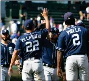  ?? ASSOCIATED PRESS ?? THE SAN DIEGO PADRES celebrate their 10-6 win against the Chicago Cubs Sunday in Chicago.COMING AND GOING