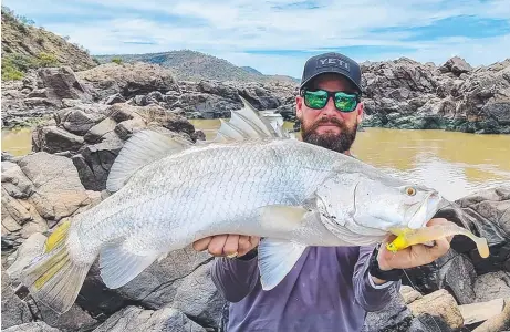  ??  ?? Nathan Kellett regularly fishes the Burdekin River's fresh waters to pull quality barramundi like this recent 90cm model.