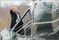  ?? AP PHOTO ?? President Donald Trump waves as he boards Marine One as he leaves Walter Reed National Military Medical Center in Bethesda, Md., Friday, Jan. 12, 2018, after his first medical check-up as president.