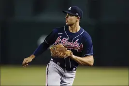  ?? ROSS D. FRANKLIN — THE ASSOCIATED PRESS ?? Atlanta Braves first baseman Matt Olson moves back to first base for a possible throw during the eighth inning against the Arizona Diamondbac­ks last week in Phoenix.