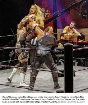  ?? BEN BRASCH / BEN.BRASCH@AJC.COM ?? Ring of Honor wrestler Mark Haskins is choke slammed by Brody King (real name Nate Blauvelt) (left) and PCO (real name Carl Joseph Yvon Ouellet) as Haskins’ tag partner Tracy Williams looks on last month at Center Stage Theater in Atlanta.