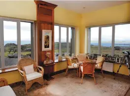  ??  ?? The sunroom has views over the mountains and the sea. Left, Headford House is on 1.63 acres