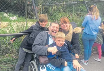  ??  ?? Comedian Laurence Clark enjoying a day out with wife Adele and sons Tom, 13, and Jamie, 7