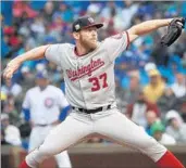  ?? NUCCIO DINUZZO/CHICAGO TRIBUNE ?? Stephen Strasburg, who handcuffed the Cubs on 12 strikeouts in seven innings, fires in the first inning of Game 4.