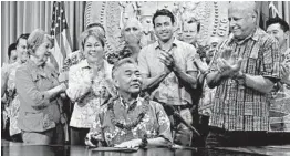  ?? AUDREY MCAVOY/AP ?? Lawmakers applaud in Honolulu as Hawaii Gov. David Ige signed legislatio­n banning chlorpyrif­os in 2018. California joined New York as the third state to ban the pesticide.