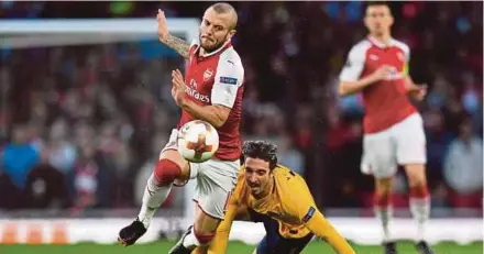  ??  ?? Jack Wilshere (left), seen here in action against Atletico Madrid in the Europa League at the Emirates Stadium in April, has announced he will be leaving Arsenal after 17 years at the club. Reuters Pic