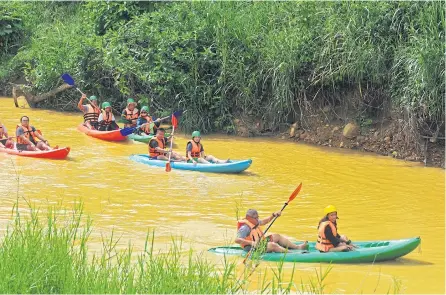  ??  ?? Abundant rainfall fills the streams in Sukhirin all year around, enabling adventurer­s to enjoy kayaking in the Saiburi River. The river flows smoothly and is interrupte­d by small rapids and bridges. As the Saiburi River runs through many fruit...