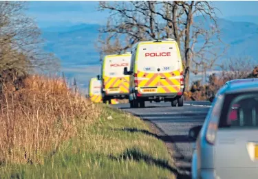  ??  ?? A convoy of police vehicles makes its way to the Blairgowri­e area from Dundee.