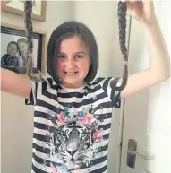  ??  ?? Locks away Ten inches of Lucy’s hair was lobbed off in aid of the Lanarkshir­e Cancer Care Trust