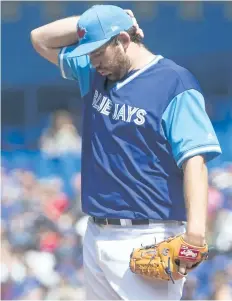  ?? CHRIS YOUNG/THE CANADIAN PRESS ?? Toronto Blue Jays’ starting pitcher Joe Biagini reacts during second inning American League baseball action against Minnesota Twins, in Toronto, on Sunday.