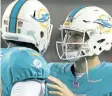  ?? WINSLOW TOWNSON/ THE ASSOCIATED PRESS ?? Julius Thomas, left, and Jay Cutler of the Miami Dolphins react after a touchdown by Thomas during a preseason game on Aug. 24. Cutler’s Dolphins will be forced by hurricane Irma to move its first game against the Tampa Bay Buccaneers to Nov. 19.