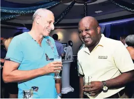  ??  ?? Glenn Lawrence (left), CEO of Couples Resorts, and Michael Lake, financial controller at Couples Swept Way, sharing a laugh.