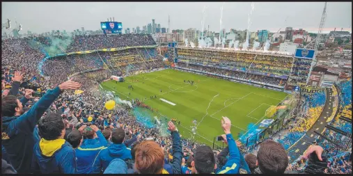  ?? AP/DANIEL LUNA ?? Boca Juniors fans cheer on their team before the September 2017 Superclási­co against River Plate at the Bombonera stadium AFAF officials want to move the Albicelest­e’s World Cup qualifier against Peru next month to the stadium, in the hope the ground’s...