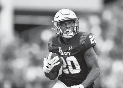  ?? GAIL BURTON/AP ?? Navy’s CJ Williams has led a slotback corps that has accounted for more than 1,400 all-purpose yards for the Midshipmen this season.