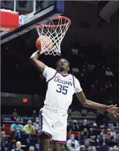  ?? Paul Connors / Associated Press ?? UConn’s Samson Johnson dunks against Long Island on Nov. 17 in Storrs.