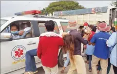  ?? SUPPLIED ?? Victims are carried to an ambulance after a mass fainting in Takeo last week. A new working group has been created to tackle the issue of mass fainting.