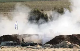 ?? ARIEL SCHALIT AP ?? An Israeli artillery unit fires toward targets in the Gaza Strip on Thursday.