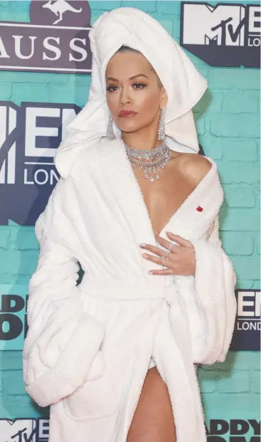  ??  ?? SKIT: Singer Rita Ora poses for photograph­ers upon arrival at the MTV European Music Awards.