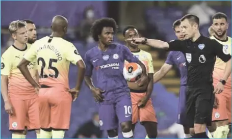  ??  ?? Chelsea’s Willian (with the ball) shortly after the VAR confirmed the penalty award against Manchester City...