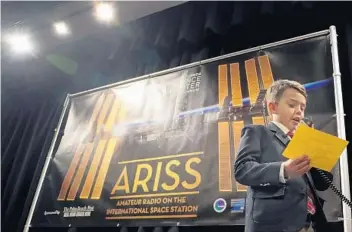  ?? PHOTOS BY AMY BETH BENNETT/STAFF PHOTOGRAPH­ER ?? Saint Andrew's School second-grader Christophe­r Andersson, 7, poses his question to astronaut Paolo Nespoli.