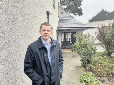  ??  ?? ● Rhun ap Iorwerth AM outside Longford House Surgery in Holyhead.