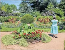  ?? DARCY RHYNO ?? A visitor enjoys the formal garden at the nearby Annapolis Royal Historic Garden, which marks its 40th anniversar­y this year.