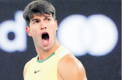  ?? AP ?? Carlos Alcaraz of Spain celebrates after defeating Miomir Kecmanovic of Serbia during their fourth round match at the Australian Open tennis championsh­ips at Melbourne Park, Melbourne, Australia on Monday, January 22, 2024.