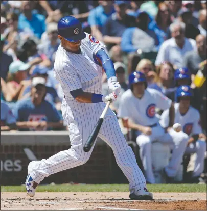  ?? The Associated Press ?? WAVE THE ‘W’: Willson Contreras hits a three-run home run off White Sox starter Carlos Rodon in the first inning of the Cubs’ 7-2 victory Tuesday at Wrigley Field.