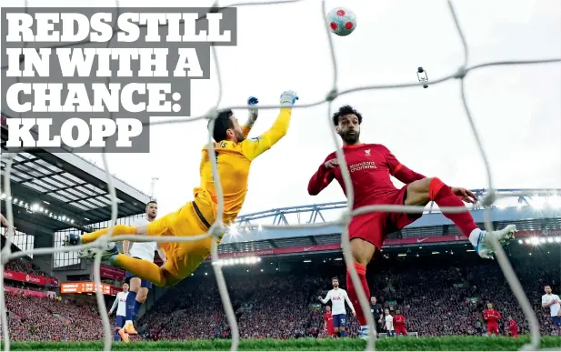  ?? AP ?? Riveting battle: Tottenham goalkeeper Hugo Lloris (left) denies Liverpool’s Mohamed Salah a chance to score during the Premier League match on Saturday. The game ended in a 1-1 draw, allowing Man City to open up a three-point lead.—