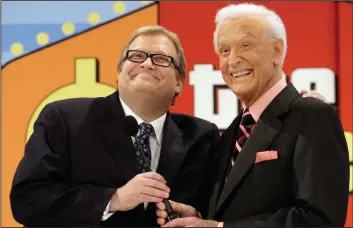  ??  ?? “The Price Is Right” host Drew Carey (left) shares a moment with longtime host Bob Barker at the CBS Studio Center in Los Angeles in 2009. (Damian Dovarganes/AP)