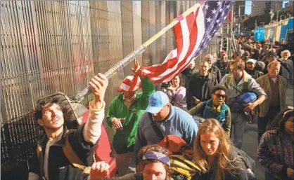  ?? Spencer Platt Getty Images ?? YOUNG AMERICANS marched against capitalism in the Occupy movement because the Great Recession hit them hard.