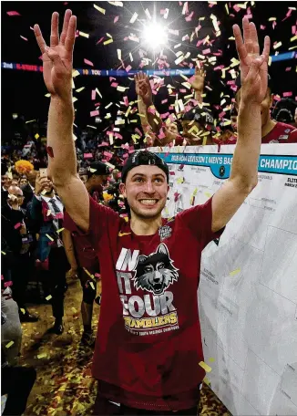  ?? CURTIS COMPTON / CCOMPTON@AJC.COM ?? Loyola-Chicago guard Ben Richardson celebrates after scoring a game-high 23 points in the Ramblers’ 78-62 win over Kansas State on Saturday in the South Regional final.