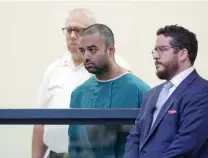  ?? ANGELA ROWLINGS / HERALD STAFF ?? EXTRADITIO­N SOUGHT: Sohan Panjirolia, center, appears at his arraignmen­t Wednesday in Cambridge District Court. Philadelph­ia police say the 31-year-old Harvard Extension School grad killed his father Aug. 3.