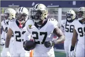  ?? STEVEN SENNE — THE ASSOCIATED PRESS ?? New Orleans Saints strong safety Malcolm Jenkins (27) smiles after his touchdown against the New England Patriots during the second half Sunday in Foxborough, Mass.