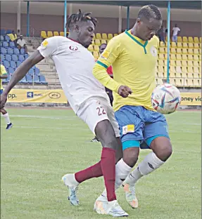  ?? (Pic: Sanele Jele) ?? WHAT FIFA RULES SAY:
Denver Sundowns attacking midfielder, Mike Dombo (R) in action in last Sunday’s MTN Premier league 5-0 win against Manzini Wanderers.