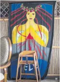  ?? TAMIR KALIFA/THE NEW YORK TIMES ?? A tapestry of Madame Pele, Hawaii’s goddess of volcanoes and fire, hangs at Pele's Kitchen, a restaurant in Pahoa.