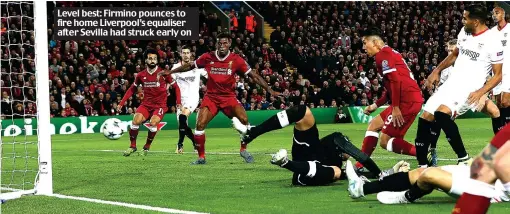  ??  ?? Level best: Firmino pounces to fire home Liverpool’s equaliser after Sevilla had struck early on