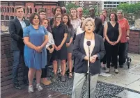  ?? ROBERT BENZIE/TORONTO STAR ?? NDP Leader Andrea Horwath, flanked by supporters, candidates and housing activists, promises to boost tenant protection­s.