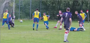  ??  ?? Reports and photograph­s: Derek Black. Goldenhill keeper Ross Clark saves from Paul Carmichael, but the Saints’ striker went on to net a double in a 3-2 win for Saints.