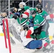  ?? TOM PENNINGTON/GETTY IMAGES ?? Things got rough on Tuesday night in Dallas as Alexander Radulov (47) of the Dallas Stars tussled with Florida’s Mike Matheson in the 6-1 Panthers’ loss.