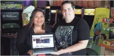  ?? JEFFERSON GRAHAM, USA TODAY ?? Mia Mazadiego and husband, Mark Guenther, run the Neon Retro Arcade in Pasadena, Calif.