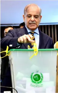  ?? ?? Islamabad: PM Shehbaz Sharif casting his vote at the Senate elections at Parliament House.