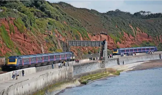  ?? MARK PIKE, ?? ScotRail will use HSTs cascaded from Great Western Railway to vastly improve the quality of its longer-distance services. On Septemer 16, two GWR HSTs pass beneath Rockstone footbridge, Dawlish.