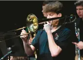  ?? KYLE TELECHAN/POST-TRIBUNE PHOTOS ?? Washington Township High School Senator Jazz member Mason Formenti performs a solo.