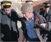  ?? POSTMEDIA NEWS FILES ?? Robert Latimer, seen here leaving court in 1998, has asked the federal justice minister for a pardon.