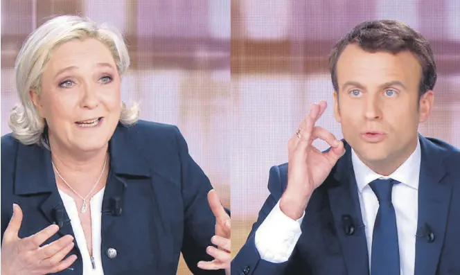  ??  ?? French President Emmanuel Macron and far-right leader Marine Le Pen face off in a final televised debate, May 3, 2017.