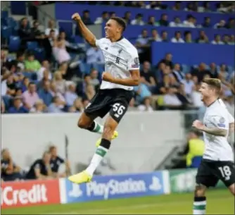  ?? MICHAEL PROBST — THE ASSOCIATED PRESS ?? Liverpool’s Trent Alexander-Arnold, left, celebrates his side’s opening goal with a free kick during a Champions League’s qualifier first- leg match in Sinsheim, Germany on Tuesday.