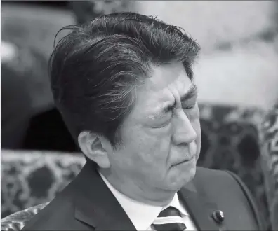  ?? Photo: AP ?? Japanese Prime Minister Shinzo Abe closes his eyes during a meeting of the upper house budget committee in Tokyo, Monday. Support for Abe has plunged amid a widening school land sale scandal linked to his wife, possibly risking chances for his third...