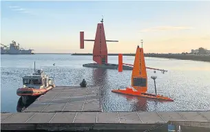  ?? SAILDRONE TRIBUNE NEWS SERVICE FILE PHOTO ?? Saildrone Surveyor, top, with Saildrone Explorer, right, and a support vessel in the San Francisco Bay's Seaplane Lagoon. Five of the vehicles are in the Atlantic Ocean to gather hurricane data.