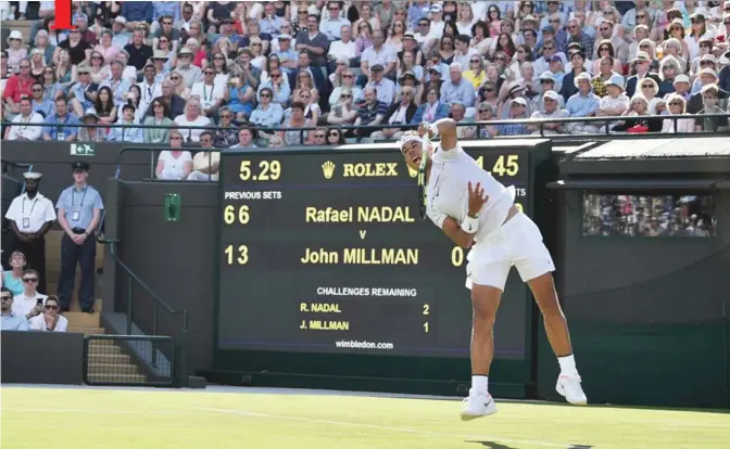  ??  ?? WIMBLEDON: Spain’s Rafael Nadal serves against Australia’s John Millman during their men’s singles first round match on the first day of the 2017 Wimbledon Championsh­ips at The All England Lawn Tennis Club in Wimbledon, southwest London yesterday.— AP